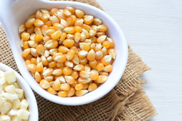 grains of natural corn in containers