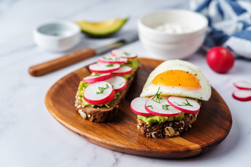 Radish avocado and egg avocado  rye sandwiches