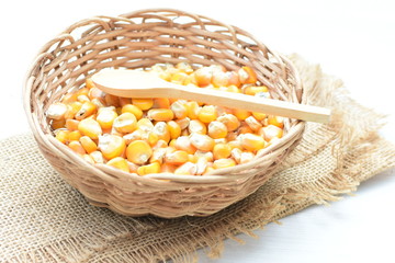 grains of natural corn in containers