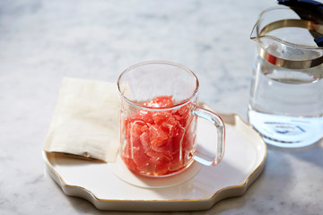 Pink grapefruit in glass cup 
