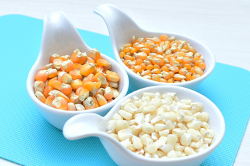 grains of natural corn in containers
