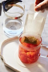 Pink grapefruit tea in glass cup 