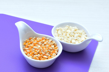 grains of natural corn in containers