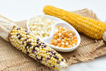 grains of natural corn in containers