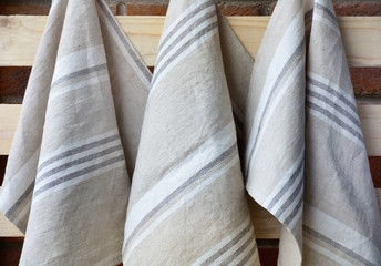 Fototapeta na wymiar Striped rough heavy linen kitchen or hand towels. Home textile