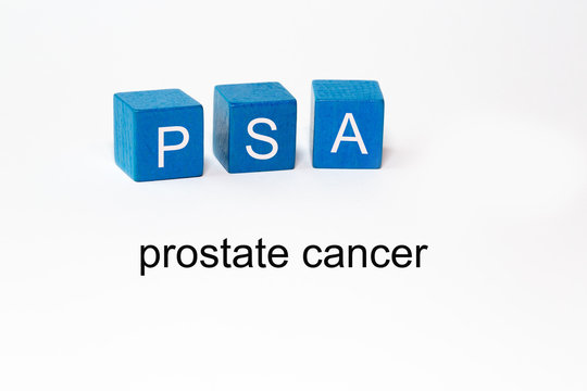 the letters PSA on blue blocks against isolated white background stand for.Prostate specific antigen. The words prostate cancer are mentioned in the photo