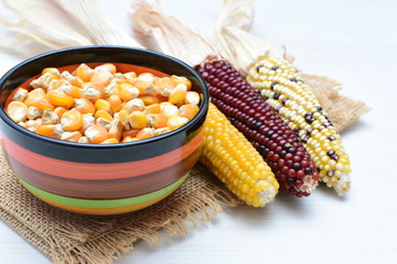 grains of natural corn in containers