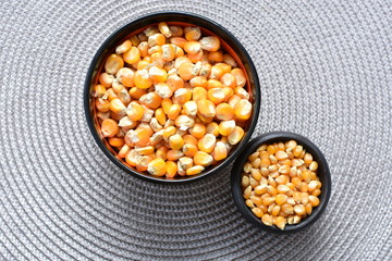 grains of natural corn in containers