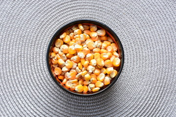 grains of natural corn in containers