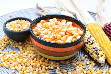 grains of natural corn in containers