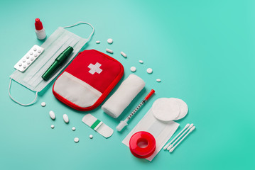 Creative layout of medicines for first aid, first aid kit for tourists, bandages, painkillers,...