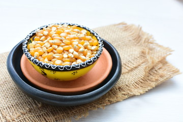 grains of natural corn in containers