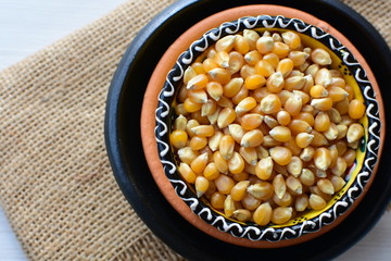 grains of natural corn in containers