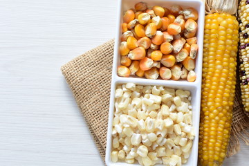 grains of natural corn in containers