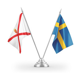 Sweden and Jersey table flags isolated on white 3D rendering