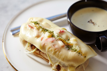 Grilled meat and cheese sandwich with potage 