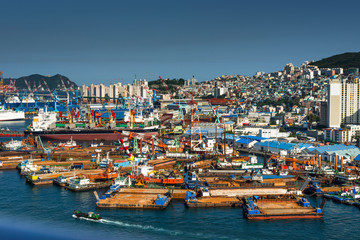 South Korea, Yeongnam Region, Busan, Port of Busan with view of tug boat moorings at Yeongdo Island.