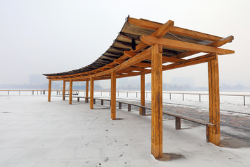 Wooden corridors in parks in winter