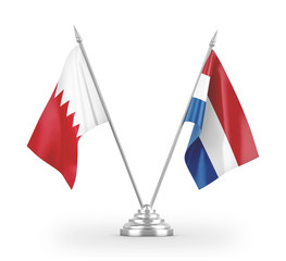 Netherlands and Bahrain table flags isolated on white 3D rendering