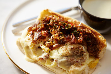 Grilled meat and cheese sandwich with potage 