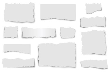 Set of paper waste on a white background. Torn paper of various shapes with shadows.