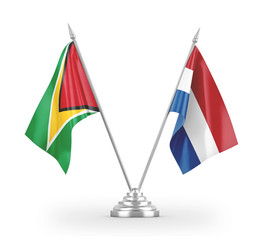 Netherlands and Guyana table flags isolated on white 3D rendering