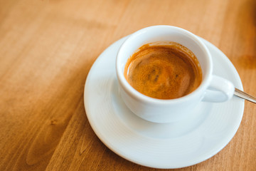 Coffee on a wooden cafe table