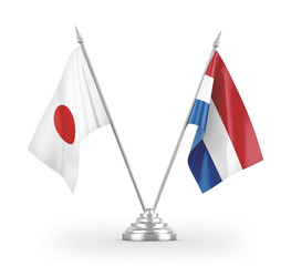 Netherlands and Japan table flags isolated on white 3D rendering