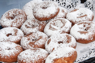 Closeup of platter of sugar donuts