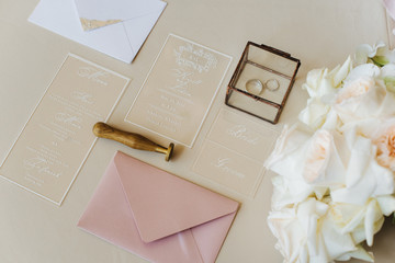 wedding invitation card with two rings and roses