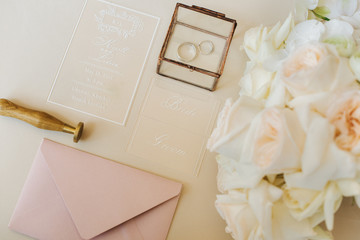 wedding invitation card with two rings and roses