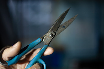 Scissors close-up. Blades of old paper cutting scissors. Hand tool. A metal item. Industrial steel product.