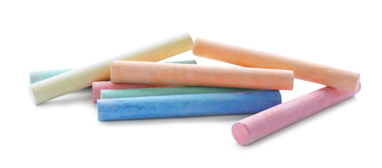 Color pieces of chalk on white background