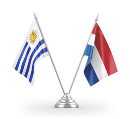 Netherlands and Uruguay table flags isolated on white 3D rendering