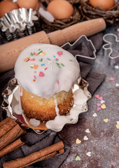 baking ingredients for a cake on dark rough background