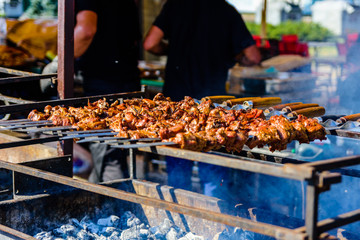 Skewers with meat over the charcoals. Cooking shashlik