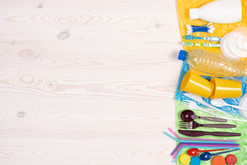 Disposable single use plastic objects such as bottles, cups, forks, spoons and drinking straws that...