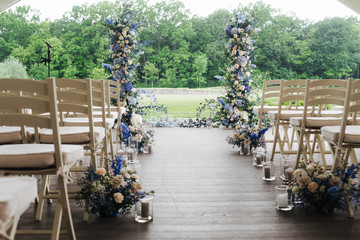 beautiful wedding arch of flowers in blue
