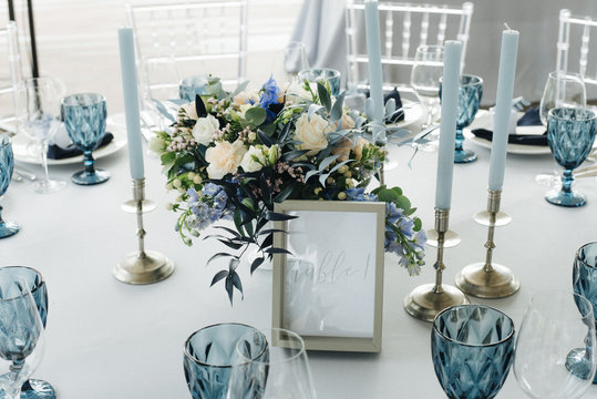table with flowers and blue wedding decorations