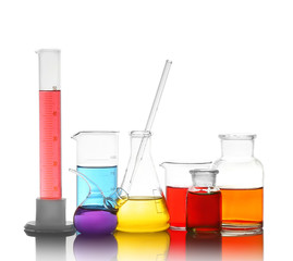 Different laboratory glassware with colorful liquids isolated on white