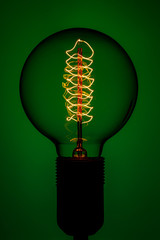 Retro Lamp on color background. Electric glow inside the lamp. Energy concept