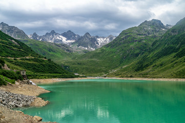 Fototapeta na wymiar Scenic view of mountains and lake Vermunt, Silvretta High Alpine Road, Austria
