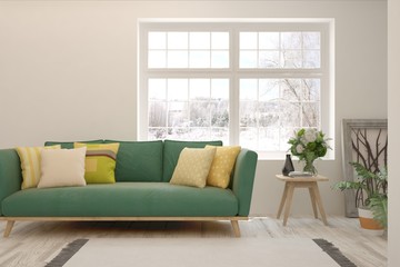 Stylish room in white color with sofa and winter landscape in window. Scandinavian interior design. 3D illustration
