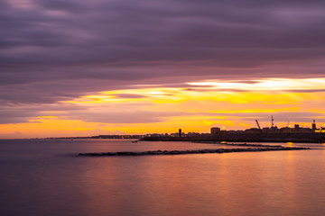Naklejka premium Beautiful sunset on the coast of Bari, Adriatic Sea.