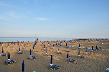 Empty beach with sun beds