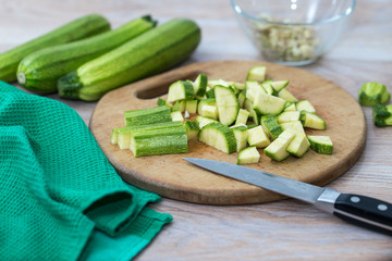 Green zucchini, sliced on a cutting Board, fresh vegetables for cooking at home