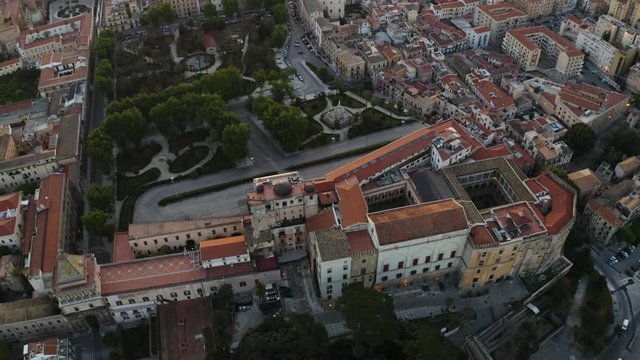 Cinematic flight in the pre-dawn hour over the Palazzo dei Normanni, and Cappella Palatina in the historic part of Palermo. Sicily. Aerial shoot