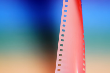 Film of an analogue camera with colorful background photographed in the studio