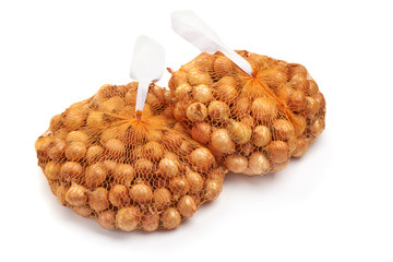 Young onion bulbs, isolated on white background