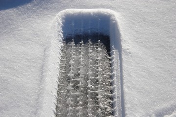 Dangerous driving conditions with snow and ice covered roads